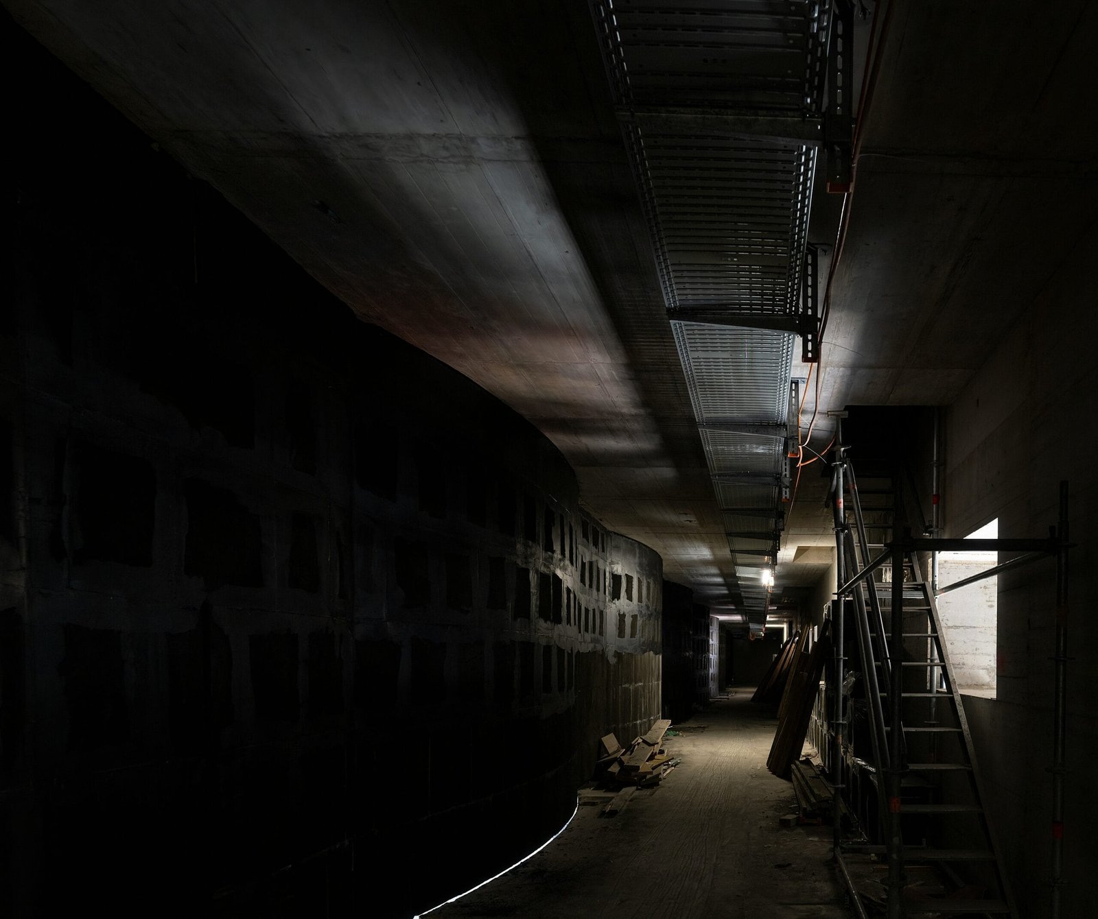 black and white tunnel with stairs